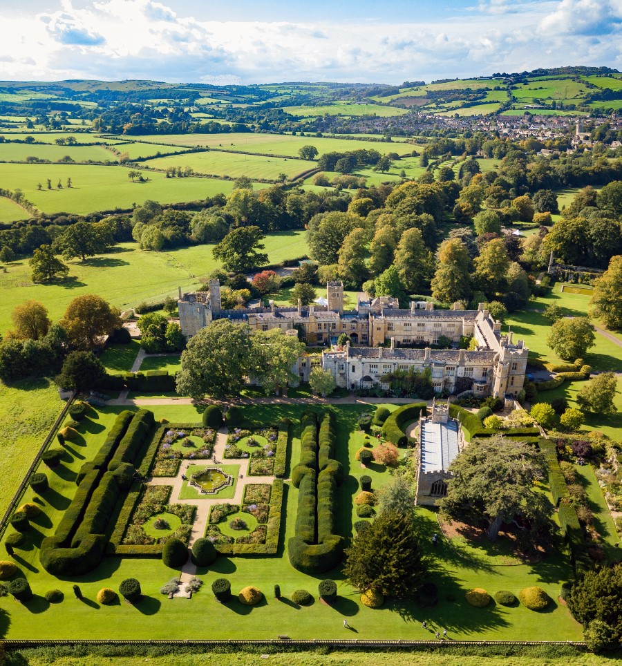 Aerial view of Sudeley Castle amongst rolling hills